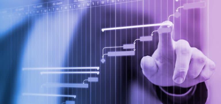A person interacts with a digital Gantt chart displaying a project timeline and tasks on a touchscreen.