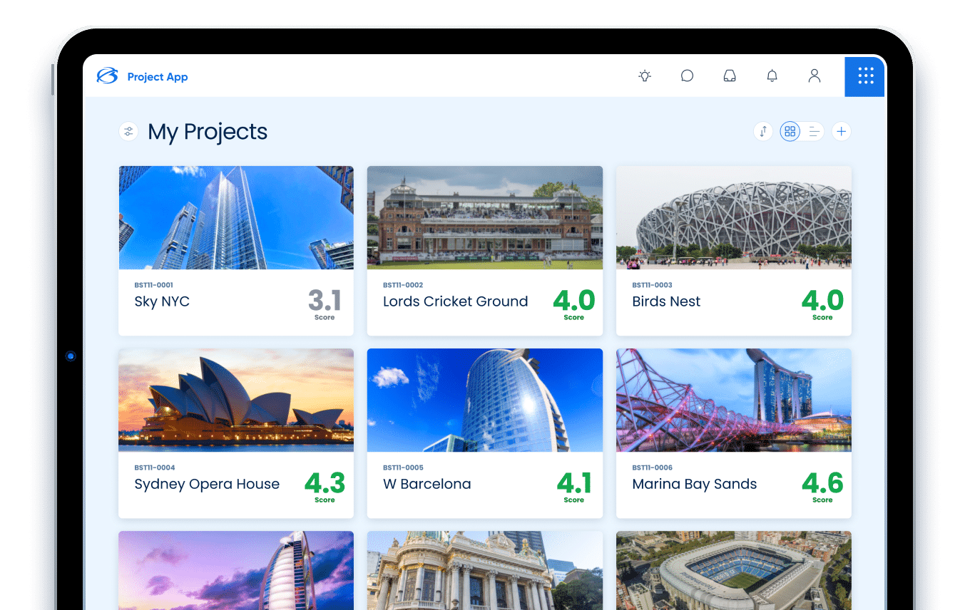 Tablet screen displaying a project management app with images of landmarks like Sky NYC, Birds Nest, and Marina Bay Sands, each with a score rating.