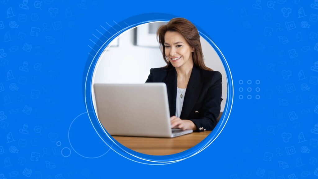 Person in a blazer working on a laptop, framed by a circular blue border with icons in the background.