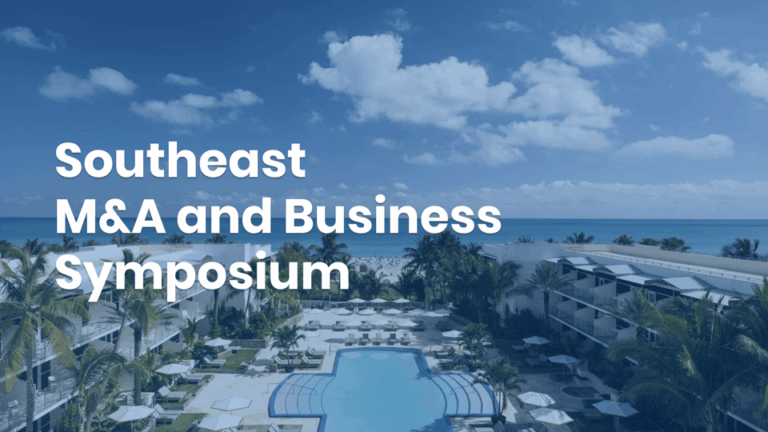 A resort pool area with palm trees and lounge chairs, overlooking a beach and ocean, with the text “Southeast M&A and Business Symposium.”.